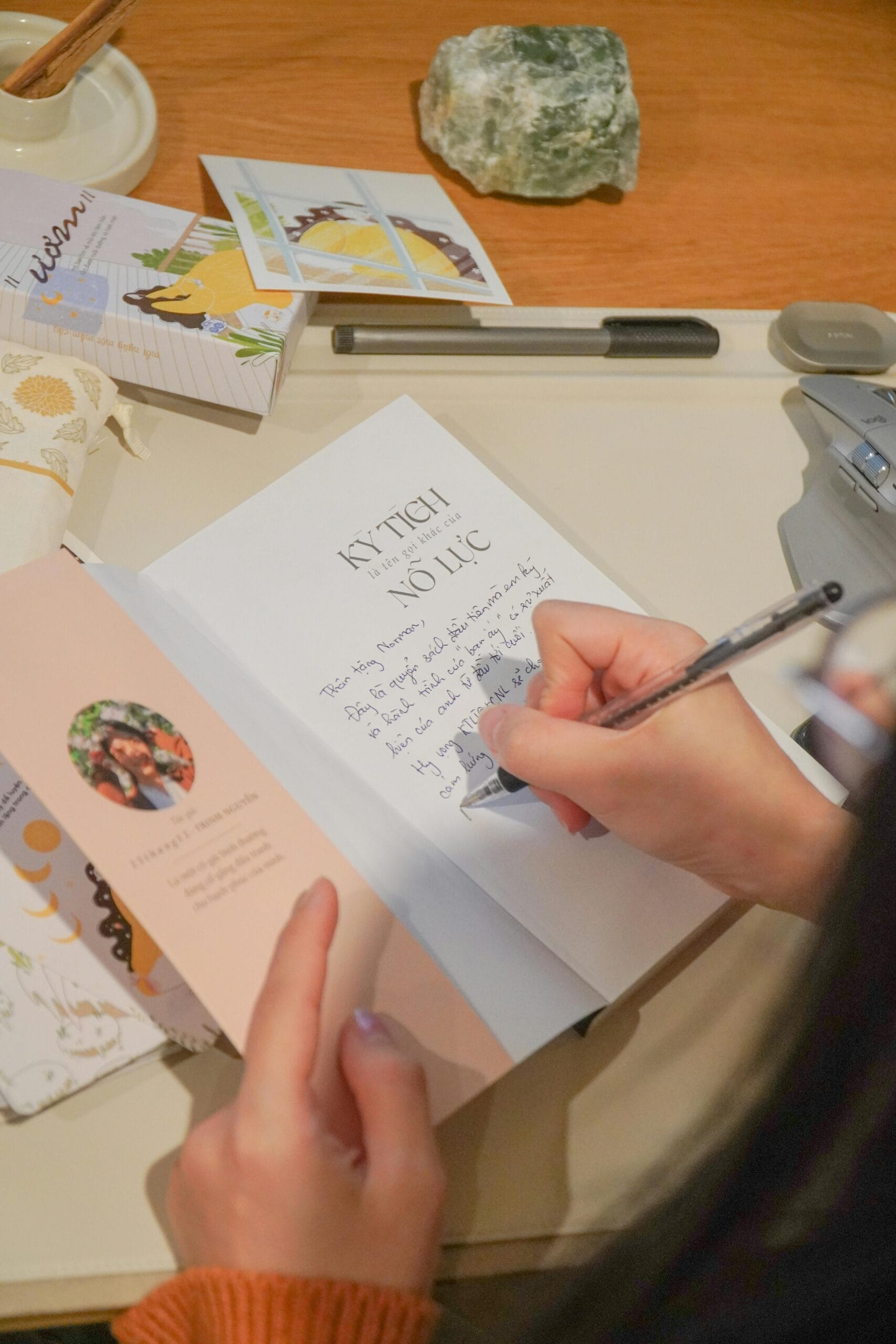 Woman writing in a cozy setting — the quiet elegance of someone who owns her style