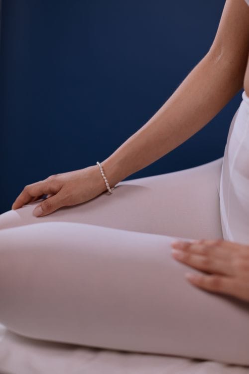 A woman wearing freshwater pearls everyday as part of her daily routine