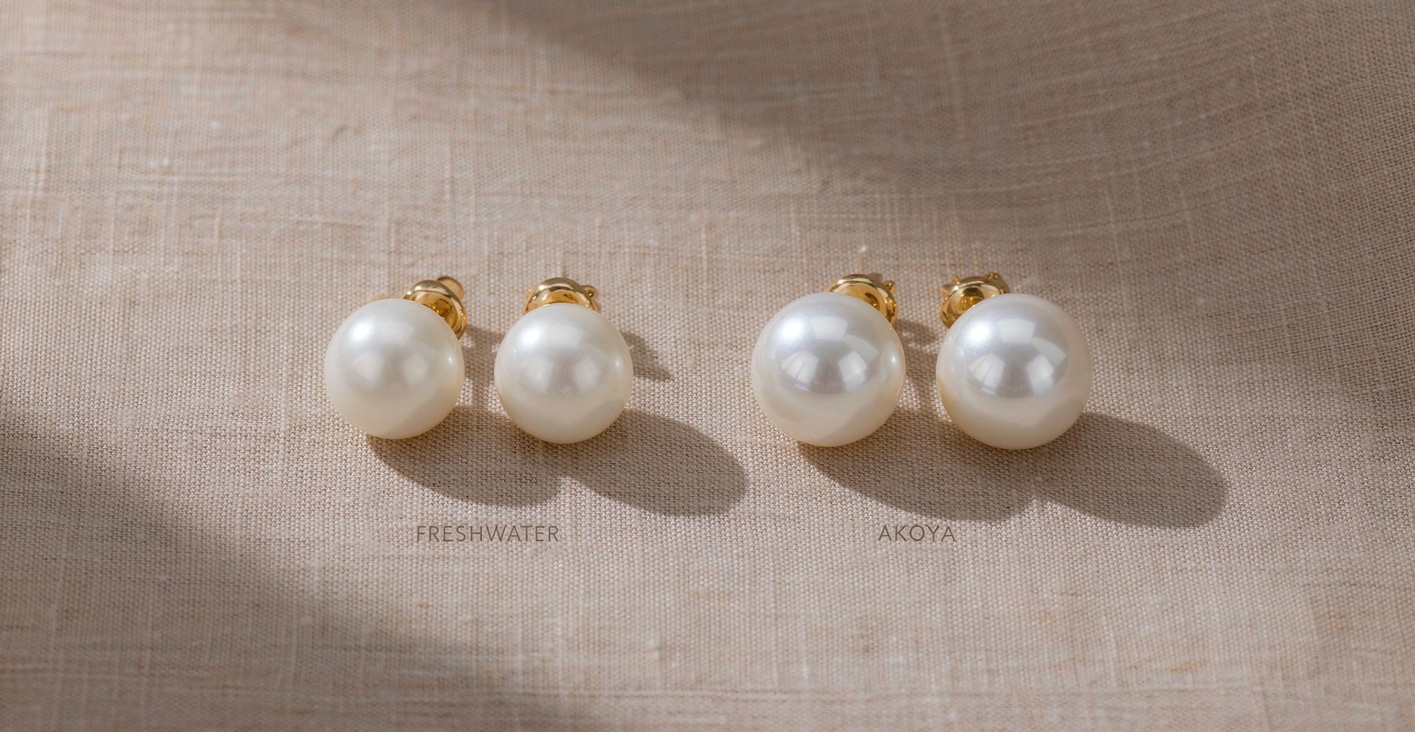 Freshwater vs Akoya pearl stud earrings side by side, both round and white