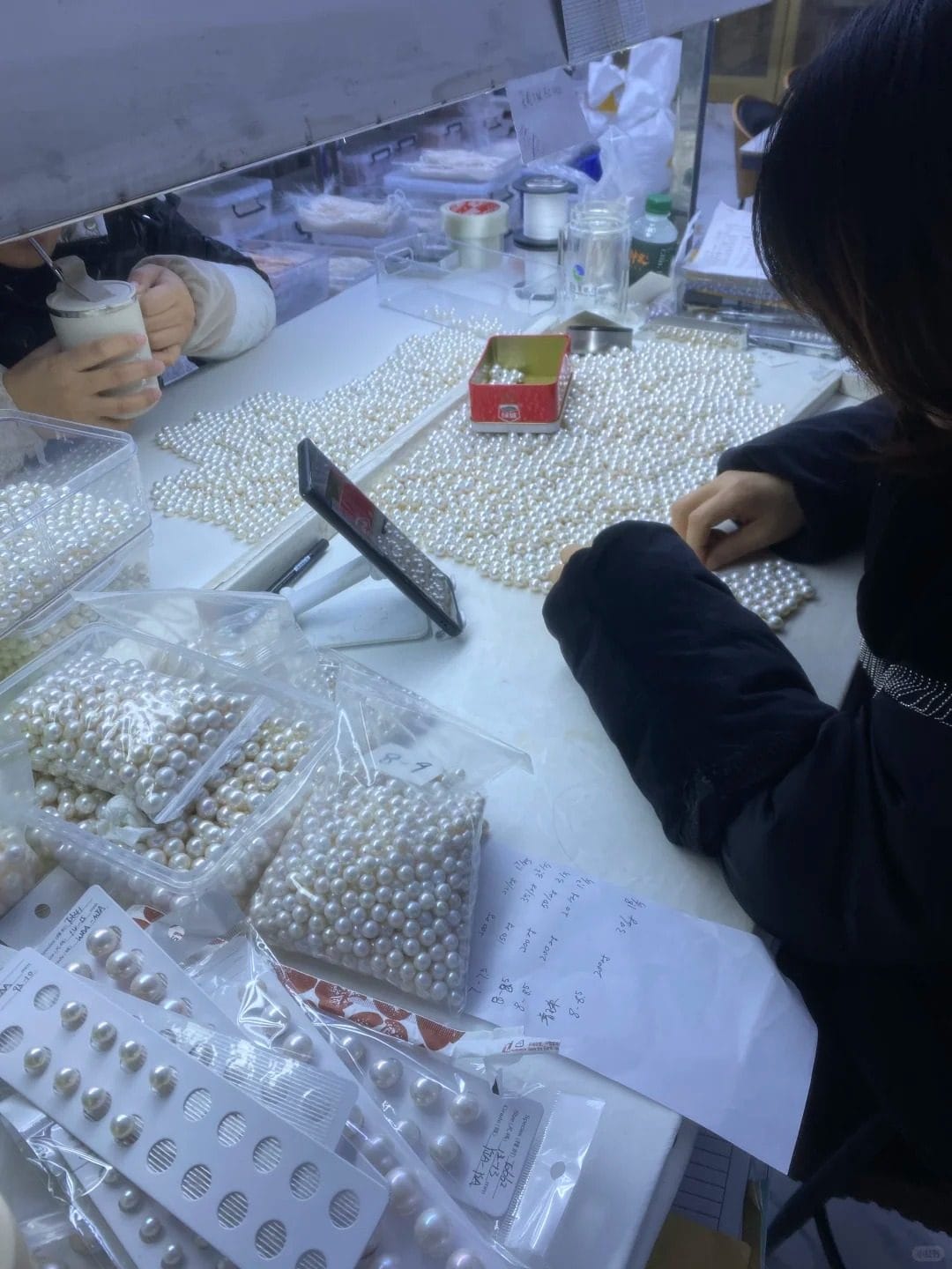 Pearl sorting at the Huadong International Pearl Market in Zhuji, China - the world's largest freshwater pearl trading center